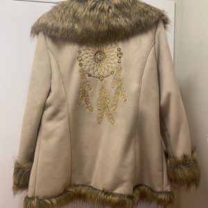 Beautiful Coat with Faux Fur Trim and Dream Catcher emblem on the back.